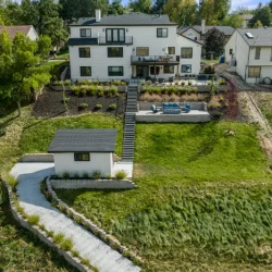 backyard photo of second level patio with furniture