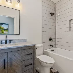 clean bathroom with heather grey cabinets