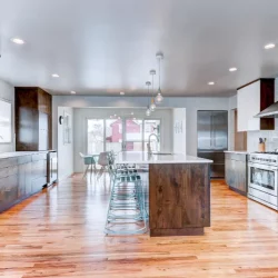 open concept kitchen with island and stools