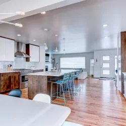 white kitchen counters with island and bar