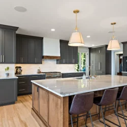 slate grey cabinets with overhead lighting over island