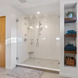 shower with floor to ceiling shelves