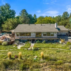 side view of home with landscape and outdoor living spaces