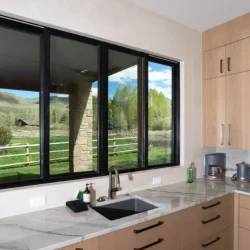 Kitchen windows over a sink with a view